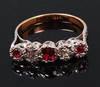 Lot 1283 - An 18ct gold, ruby and diamond dress ring,...