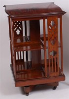 Lot 1532 - An Edwardian walnut revolving bookcase, having...