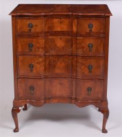 Lot 1554 - A 1920s figured walnut and crossbanded shaped...