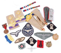 Lot 428 - A collection of various cap badges, medal...