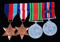 Lot 457 - A group of four WW II medals to include...