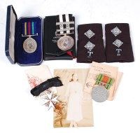 Lot 463 - A WW II Defence medal with paperwork to Mrs...