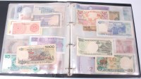 Lot 182 - A folder of approx 70 Asian banknotes to...