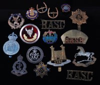 Lot 220 - A collection of assorted military badges and...