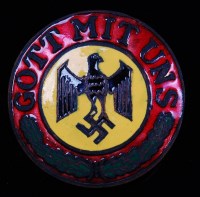 Lot 292 - A German enamelled badge, having a central...