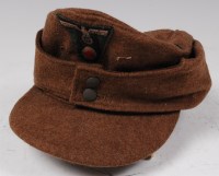 Lot 393 - A German Luftwaffe M43 field cap of small size.