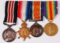 Lot 397 - A WW I group of four medals to include Geo. V....