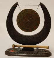Lot 16 - An early 20th century Burmese carved table gong