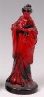 Lot 46 - A Royal Doulton flambe glazed ceramic figure...