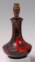 Lot 69 - A Moorcroft pottery flambe table lamp, in the...