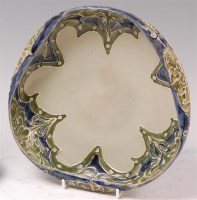 Lot 74 - An Art Nouveau Moorcroft Florian ware shallow...