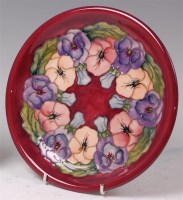 Lot 76 - A modern Moorcroft pottery charger, underglaze...