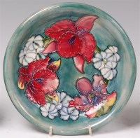 Lot 82 - A Moorcroft pottery plate, in the Orchid...