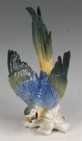 Lot 99 - A Karl Ens glazed porcelain figure of a parrot,...