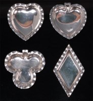 Lot 132 - A collection of four early 20th century silver...