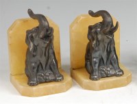 Lot 184 - A pair of Art Deco patinated spelter and onyx...