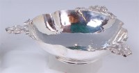 Lot 147 - An Arts & Crafts silver three handled table...
