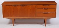 Lot 327 - A 1960s teak sideboard, having twin cupboard...