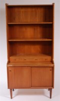 Lot 332 - A 1960s Danish teak bookcase cupboard, of...