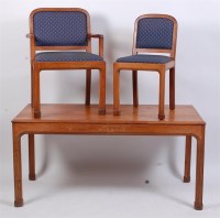 Lot 366 - A late Arts & Crafts oak dining suite,...