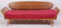 Lot 373 - A 1960s Ercol light elm three seater surfboard...
