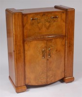 Lot 384 - A good Art Deco figured walnut cocktail...