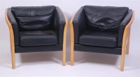 Lot 323 - A pair of 1960s Danish beech and black leather...