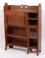 Lot 339 - An Arts & Crafts oak combination students...