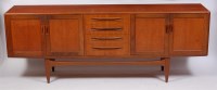 Lot 354 - A 1960s G-Plan teak long sideboard, having...