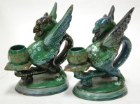 Lot 4 - A pair of CH Brannam pottery candle holders in...