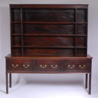 Lot 1121 - A George III oak dresser, having associated...