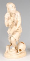 Lot 1015 - A Japanese Meiji period carved ivory okimono...