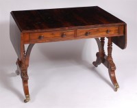 Lot 1149 - A Regency rosewood sofa table, having twin...