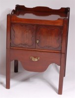 Lot 1152 - A George III mahogany commode, the tray top...