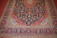 Lot 1154 - A Persian woollen Tabriz carpet, the blue...