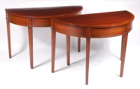 Lot 1179 - A pair of mahogany and crossbanded demi-lune...