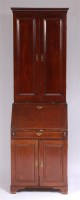 Lot 1182 - An antique walnut bureau cabinet, of narrow...