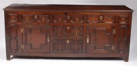 Lot 1192 - An early 19th century geometric moulded oak...