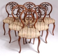 Lot 1126 - A set of six Victorian walnut balloon back...