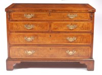 Lot 1140 - A walnut and figured walnut bachelors chest,...