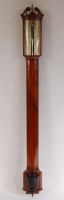 Lot 1116 - An early 19th century walnut bowfront stick...