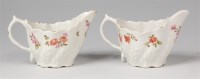 Lot 656 - A pair of Lowestoft porcelain cream boats, of...
