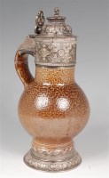 Lot 692 - A 17th century stoneware bellamine jug, having...