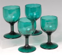 Lot 699 - A set of four early 19th century green glass...