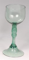 Lot 701 - An 18th century continental green tinted...