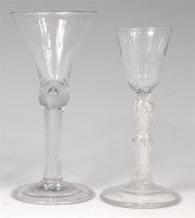 Lot 703 - An 18th century wine glass, the drawn trumpet...
