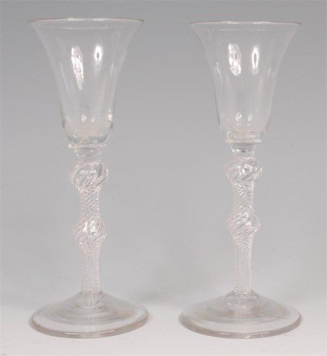Lot 705 - A pair of mid-18th century pedestal wine...