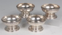 Lot 741 - A set of four George IV silver pedestal table...