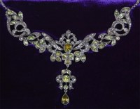 Lot 748 - A 19th century gilt metal, diamond and peridot...