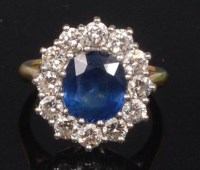 Lot 779 - An 18ct gold, sapphire and diamond cluster...